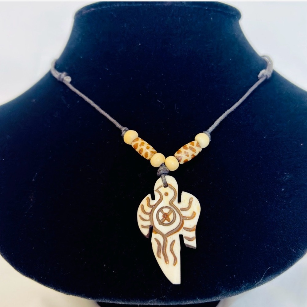 Handcraved bone eagle pendent necklace.